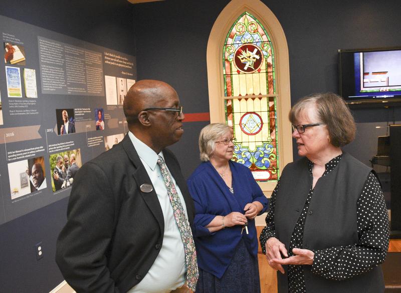 Diaz Bonville, left, Kent/Sussex County Outreach Coordinator for Rep. Lisa Blunt Rochester, talks with Marie Mayor, MHS Board of Trustees chair, and MHS Former Interim Director Lee Revis Plank, center.
